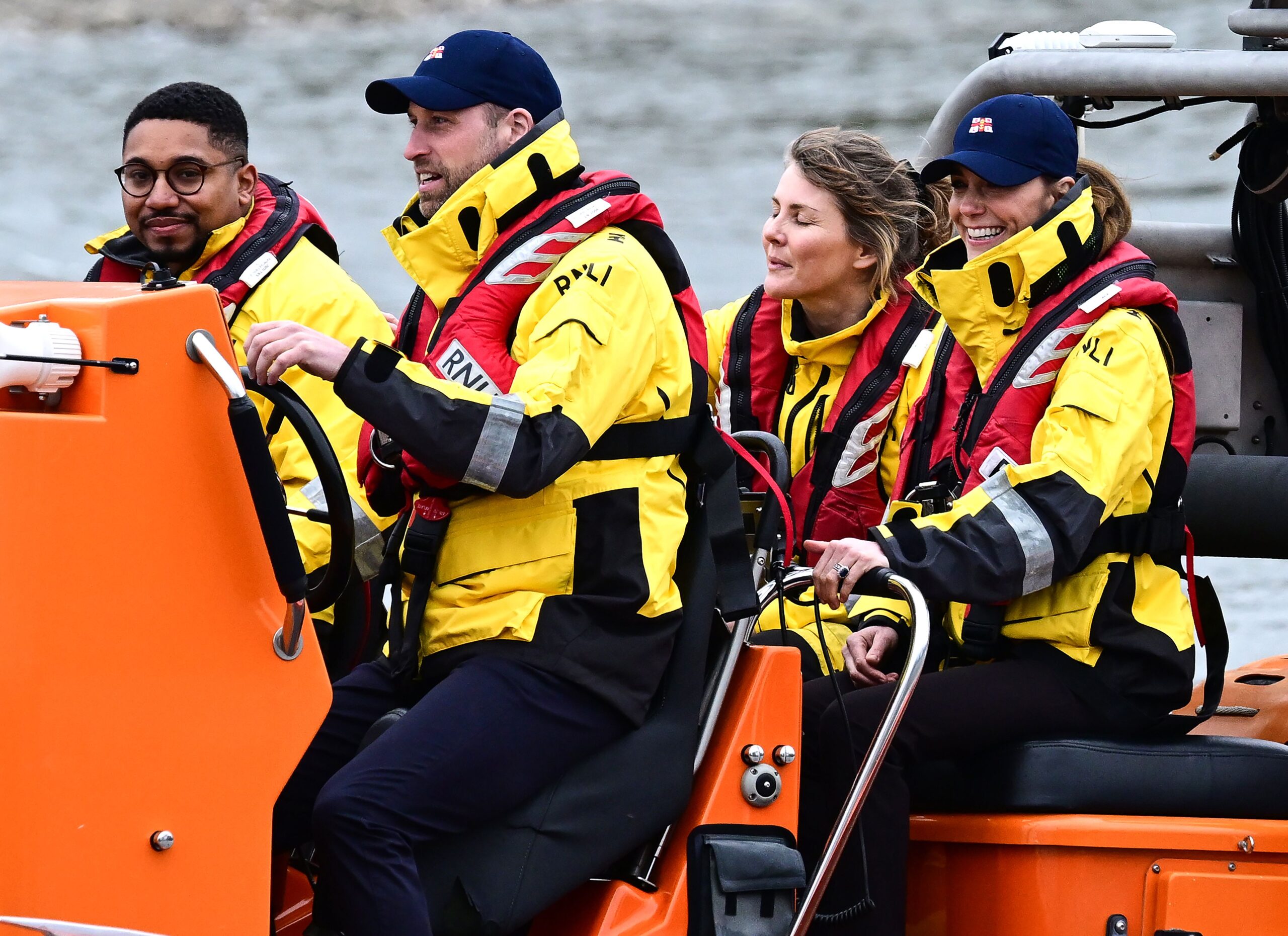 Prince William and Princess Kate on an RNLI lifeboat travelling down the River Thames