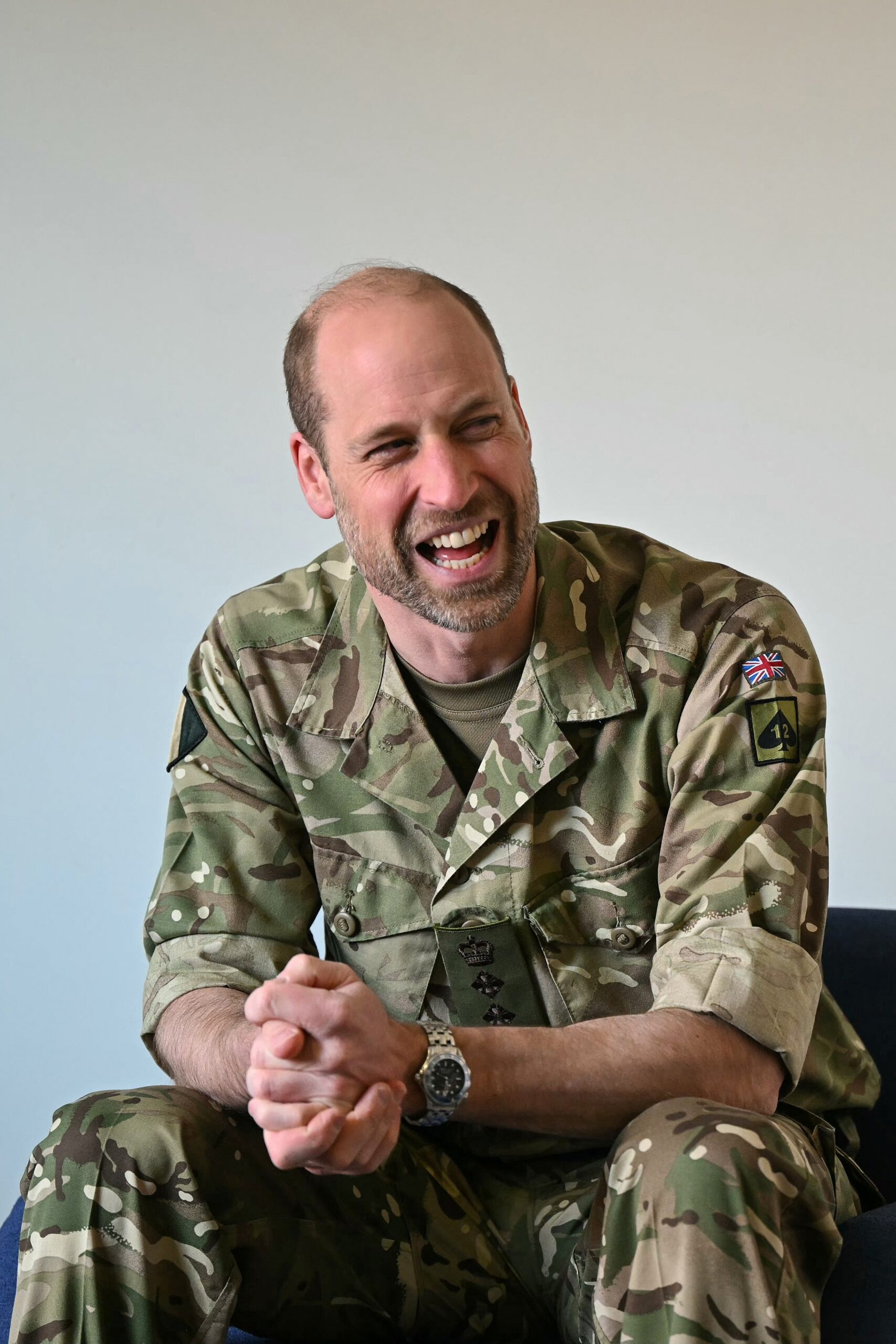 Prince William laughing in military uniform