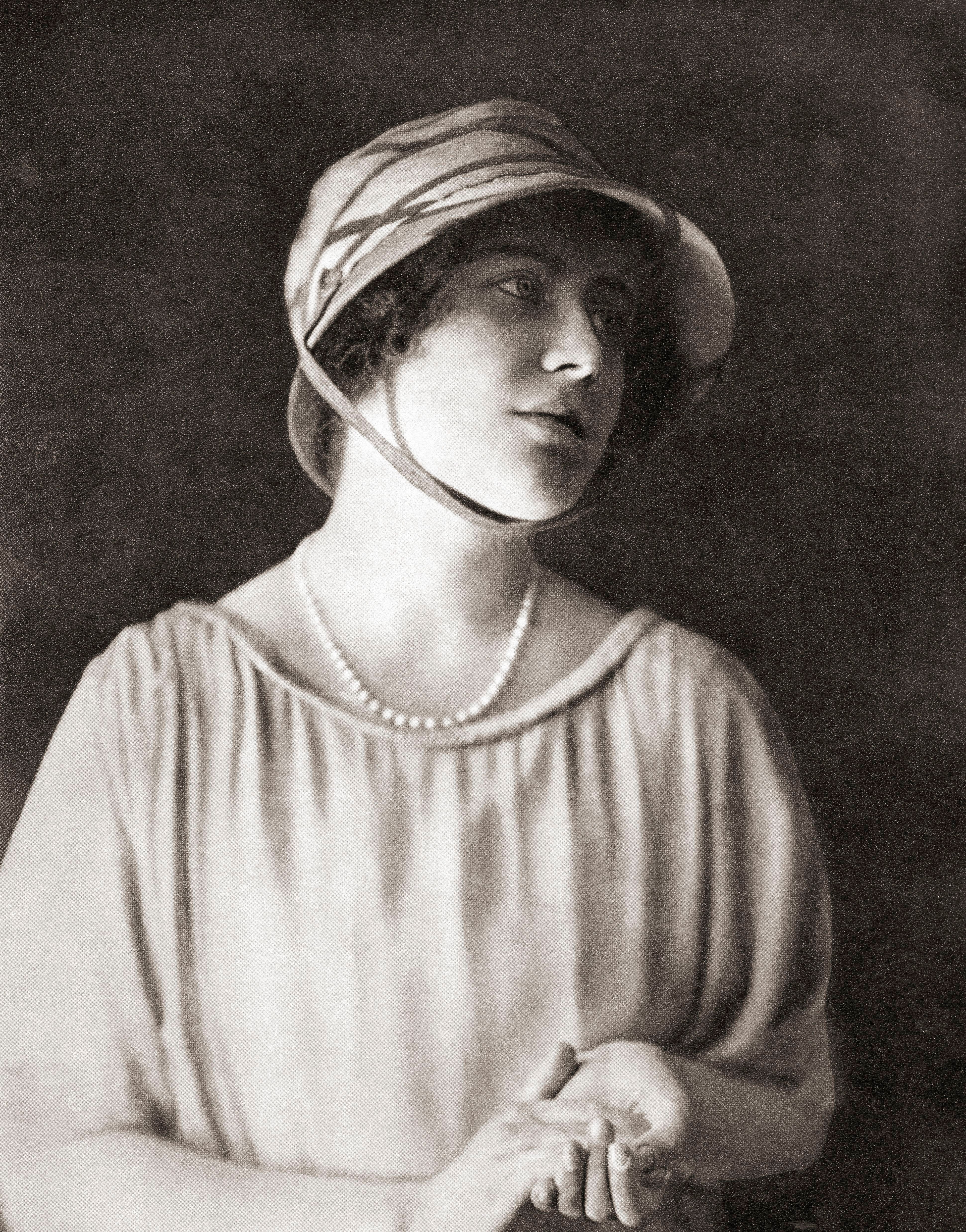 The Queen Mother, Elizabeth Bowes-Lyon, when she was young, wearing a bonnet, photographed in 1937 when she was 21