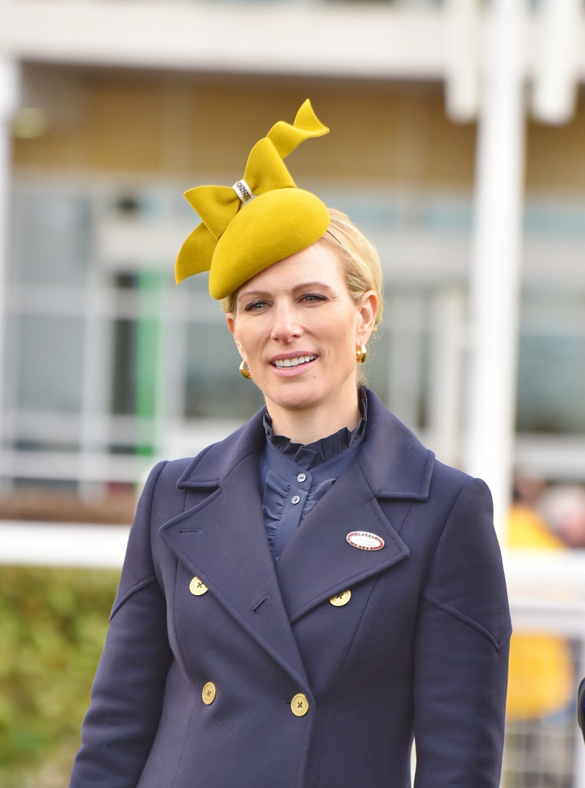 Zara Tindall wearing a yellow hat