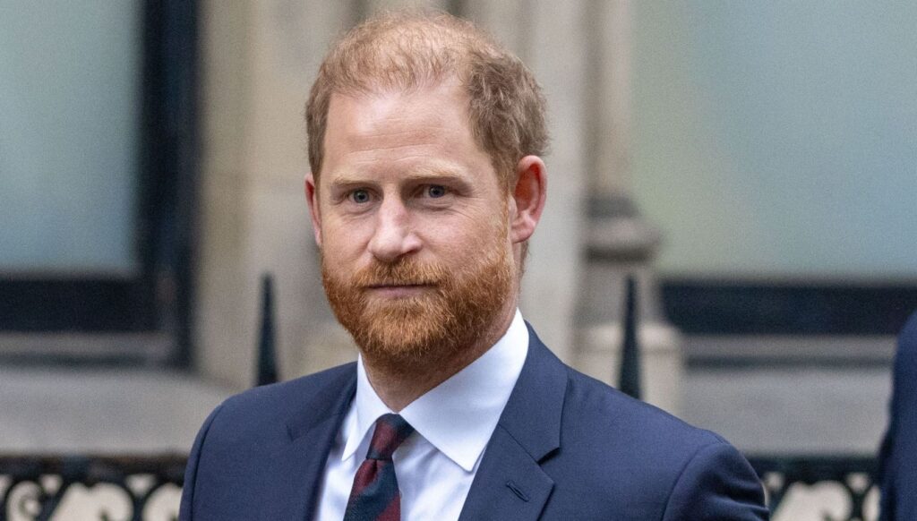 Prince Harry in suit during UK return
