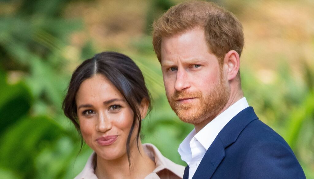 Meghan Markle and Prince Harry looking at the camera