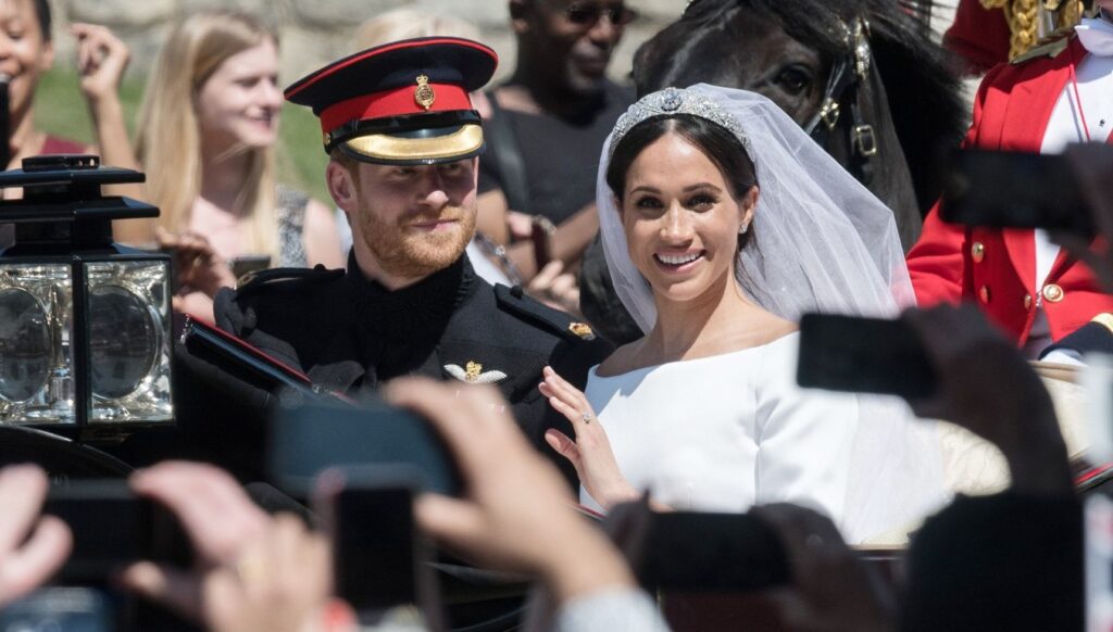 Prince Harry and Meghan Markle smiling on their wedding day