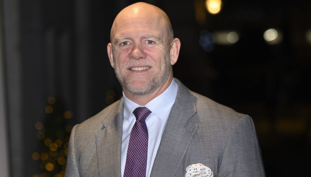 Mike Tindall in grey suit, smiling