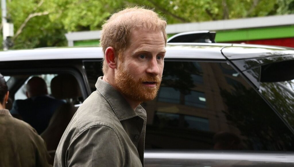 Prince Harry getting into a car in Australia