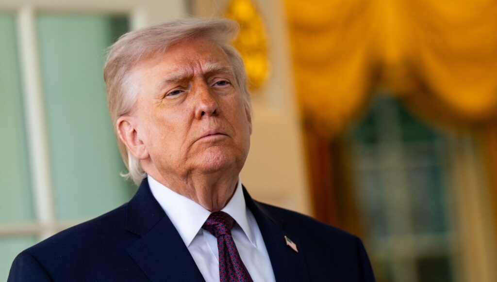 Donald Trump in a suit, looking serious