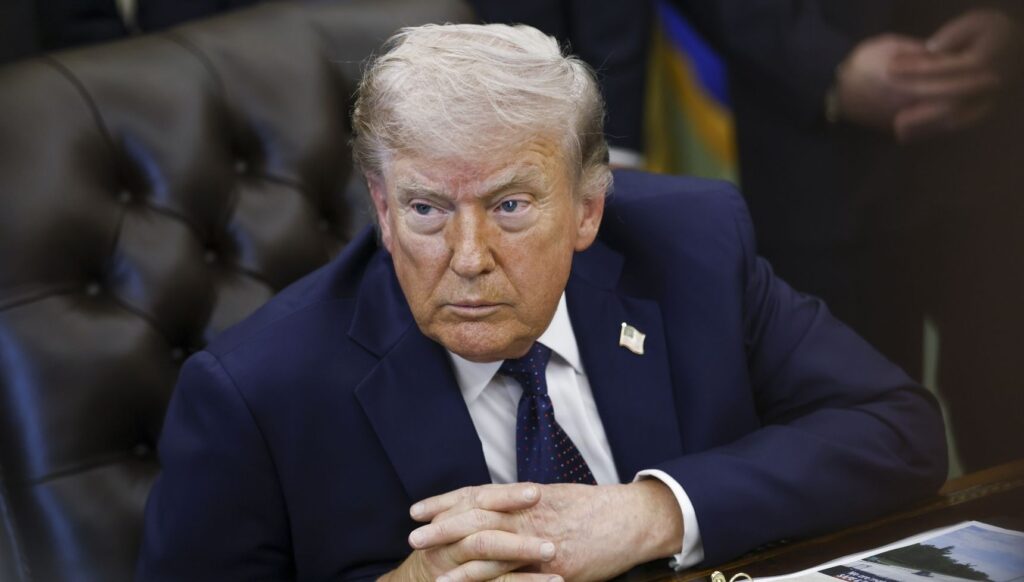 Donald Trump answering questions in suit