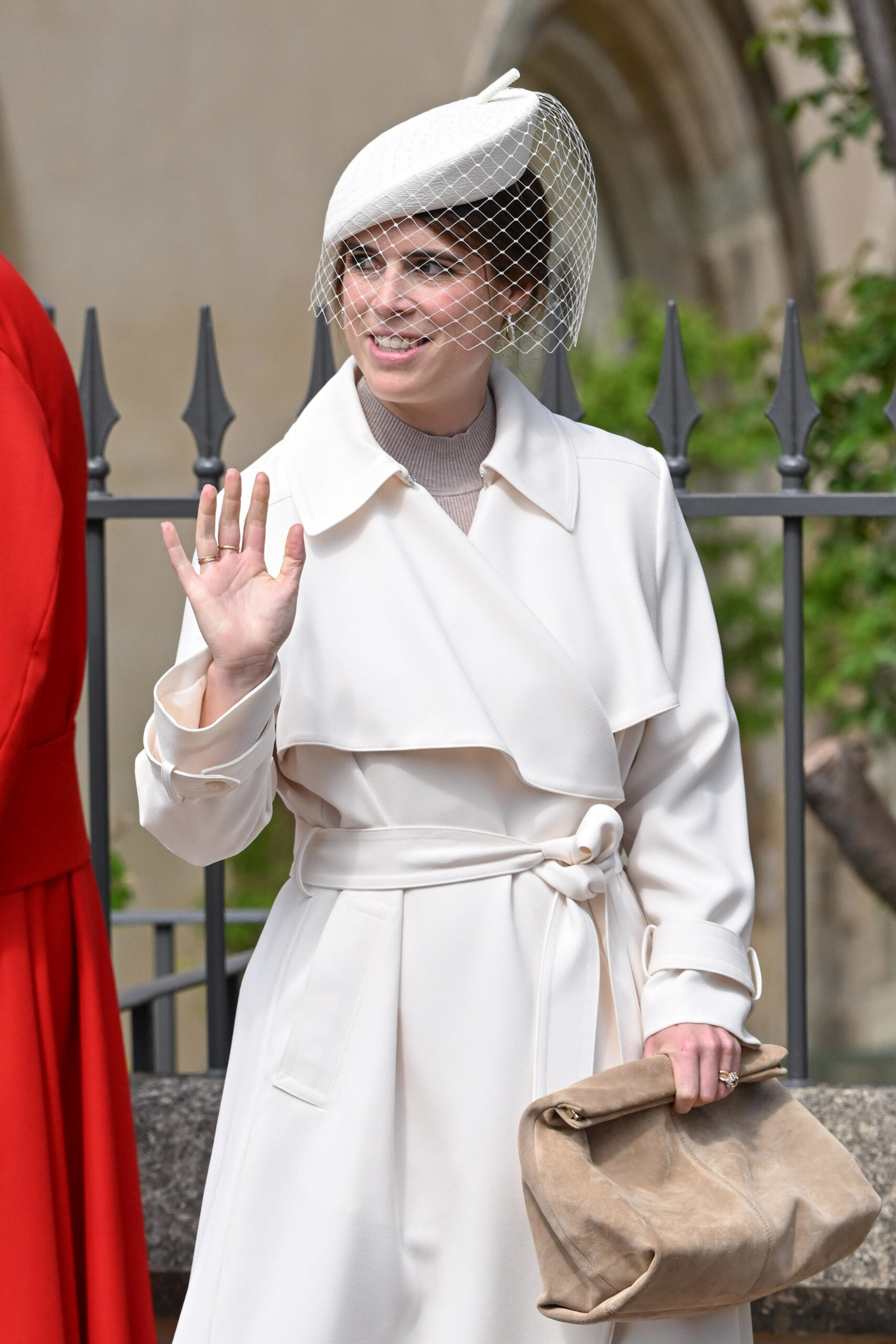 Princess Eugenie waving in white outfit at Easter service