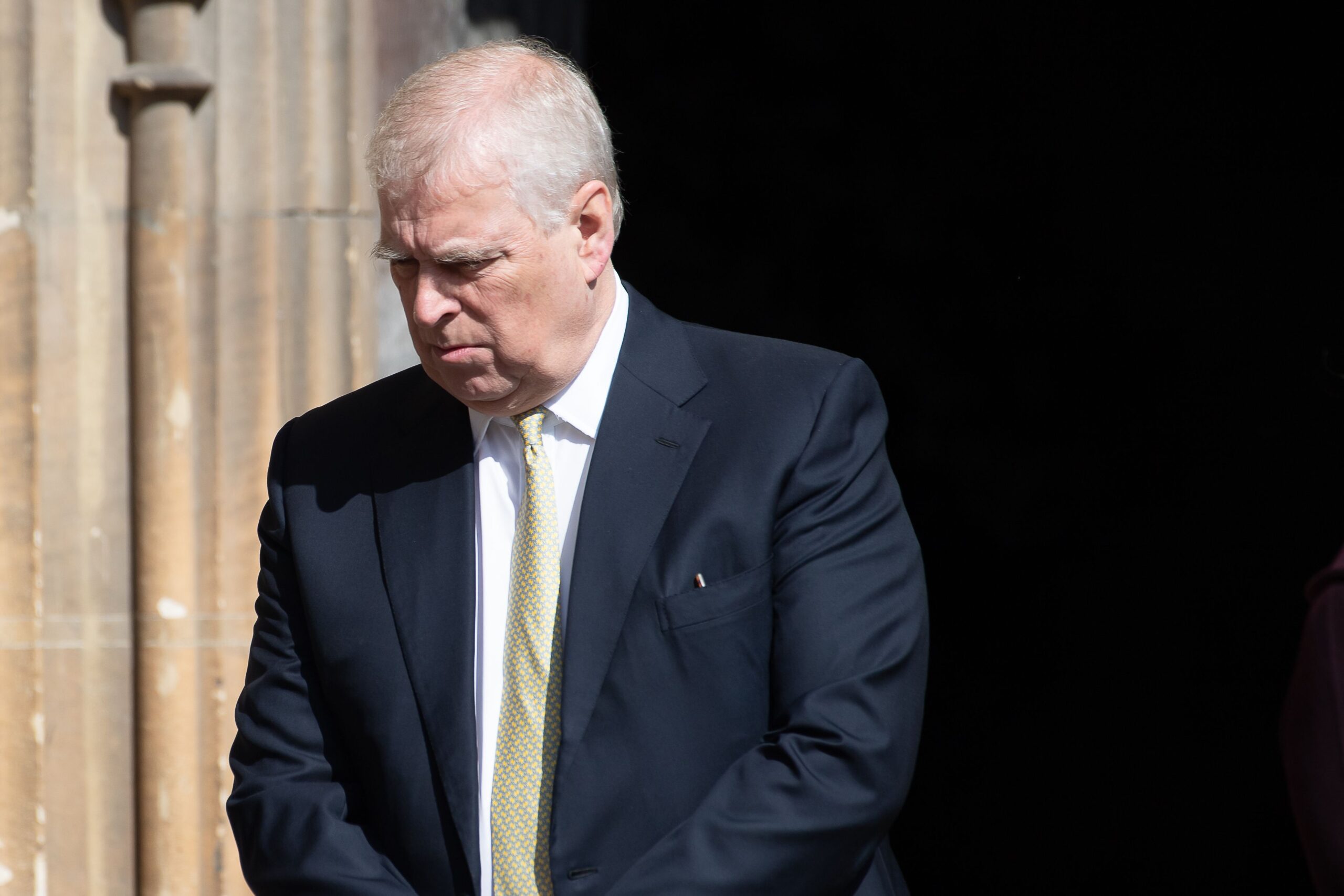 Andrew Mountbatten-Windsor looking down and frowning