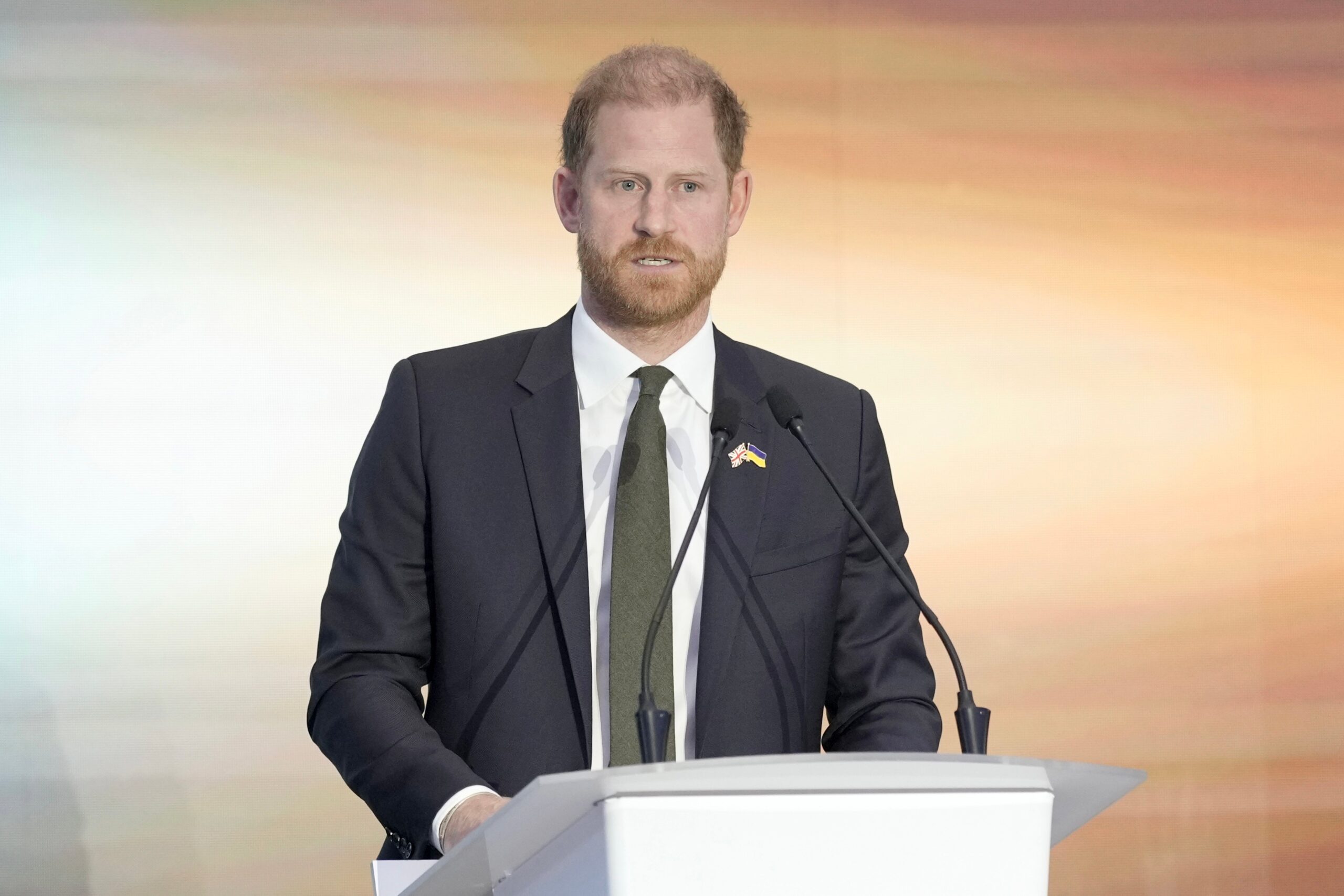 Prince Harry speaking at a podium
