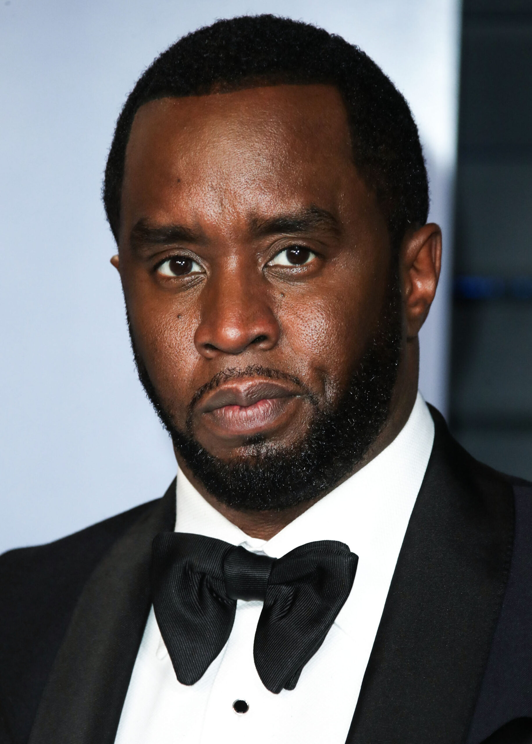 Diddy wearing a suit