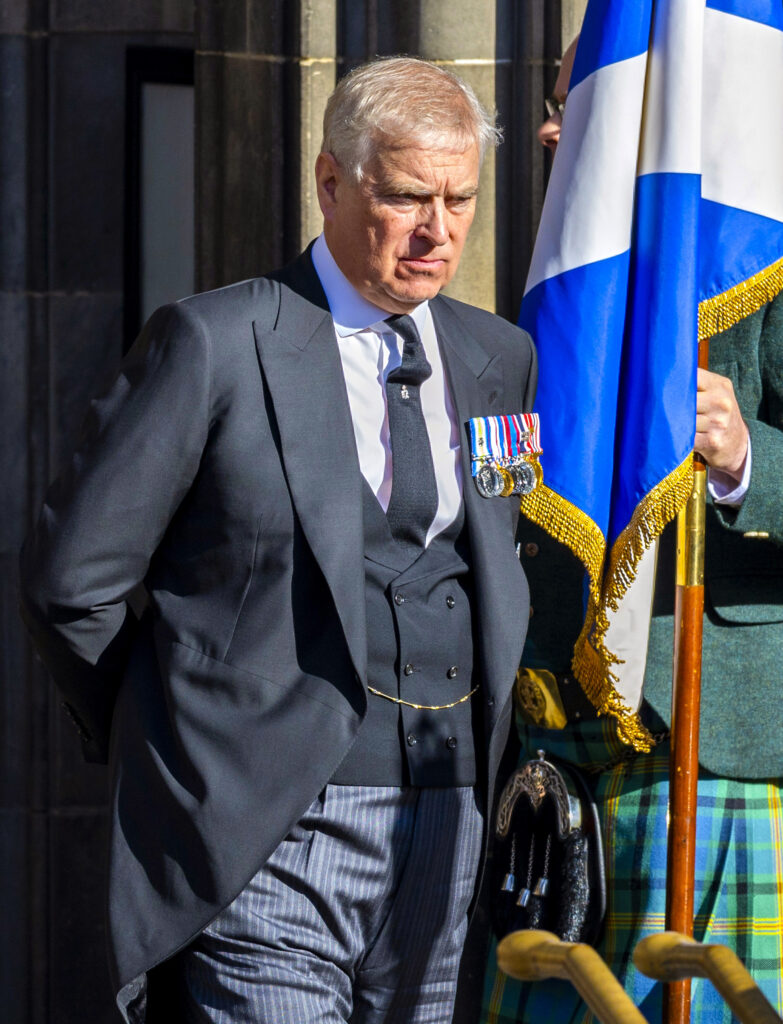 Andrew Mountbatten-Windsor frowning and looking down