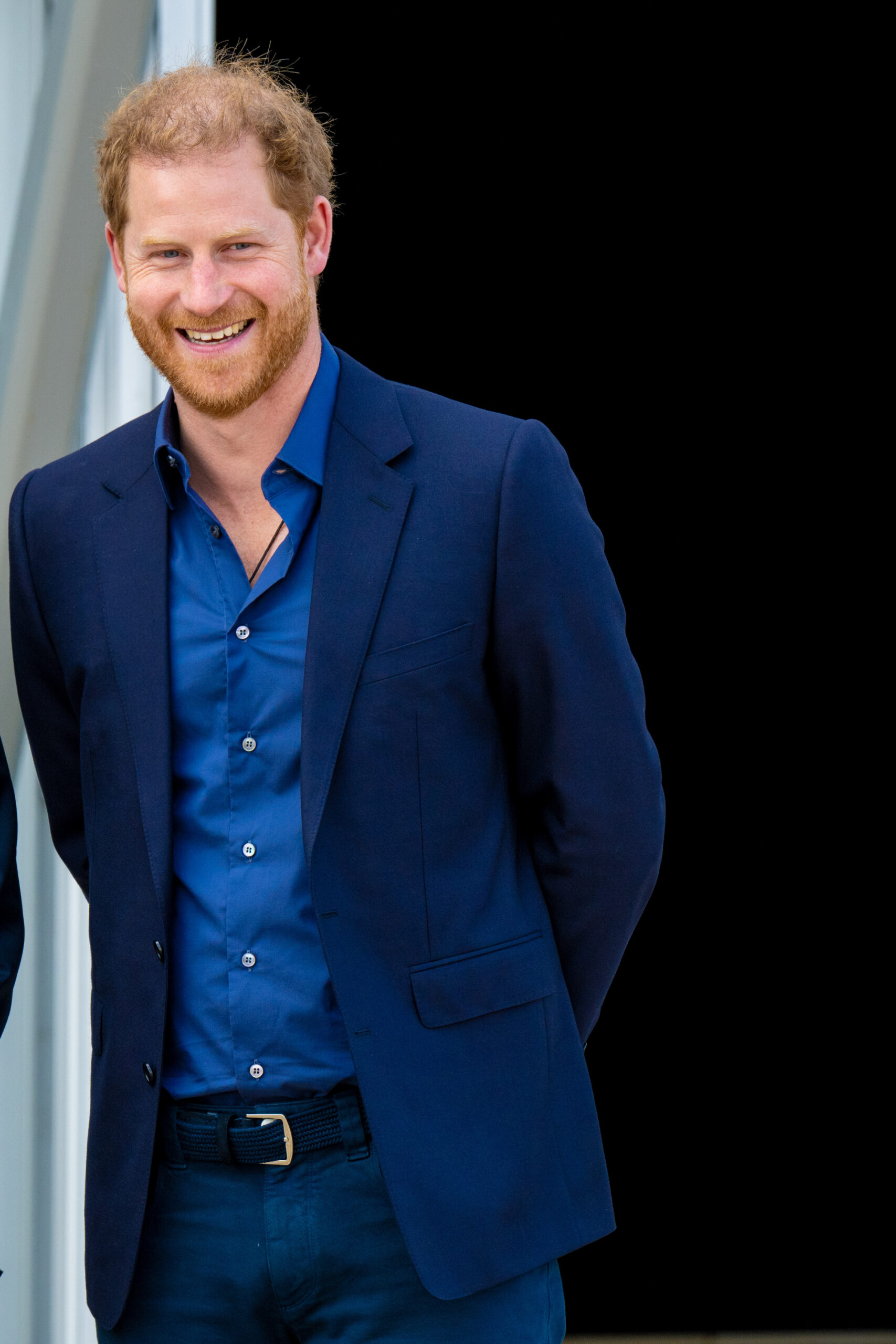 Prince Harry smiling in suit 
