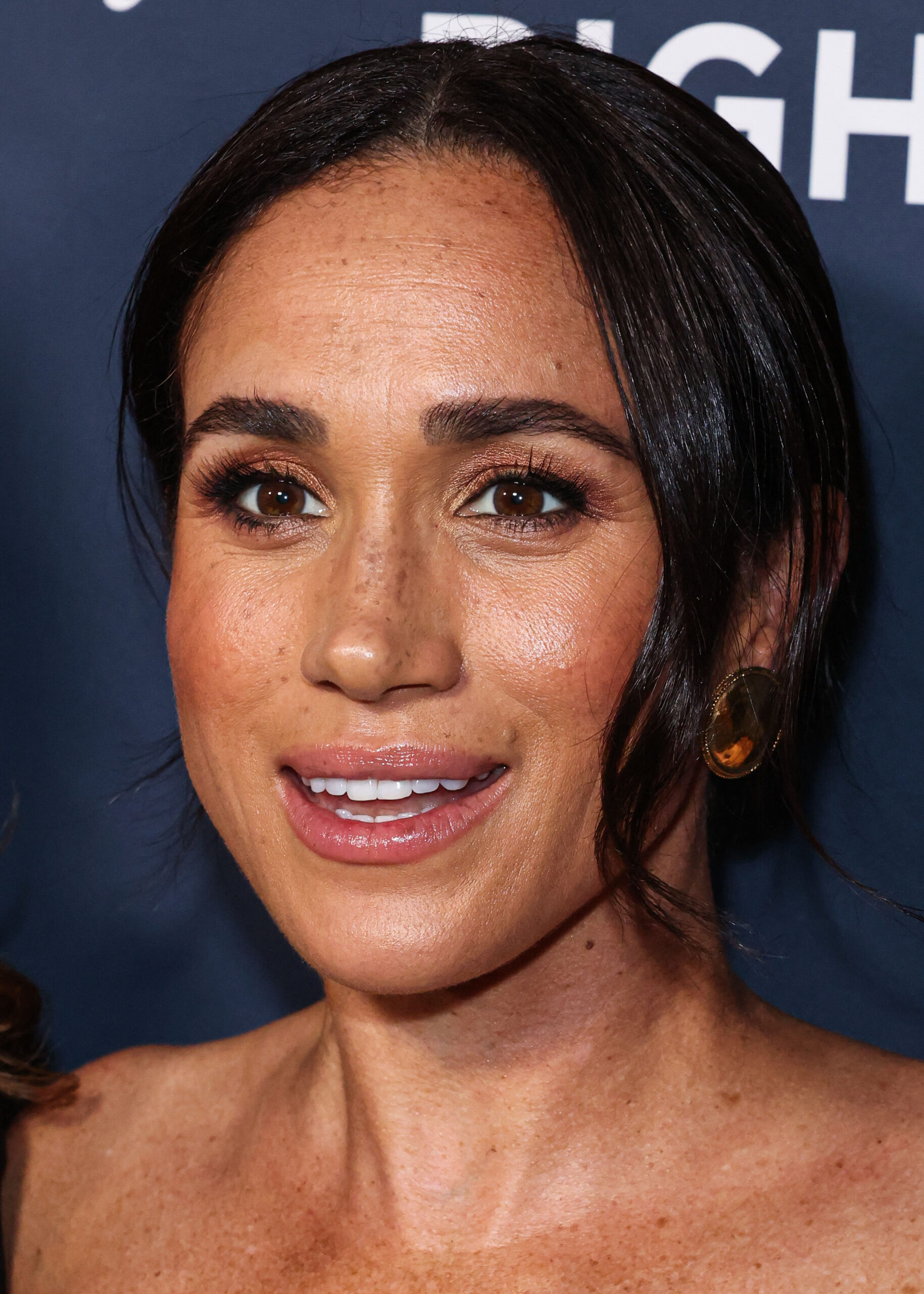 Meghan Markle with a shocked expression