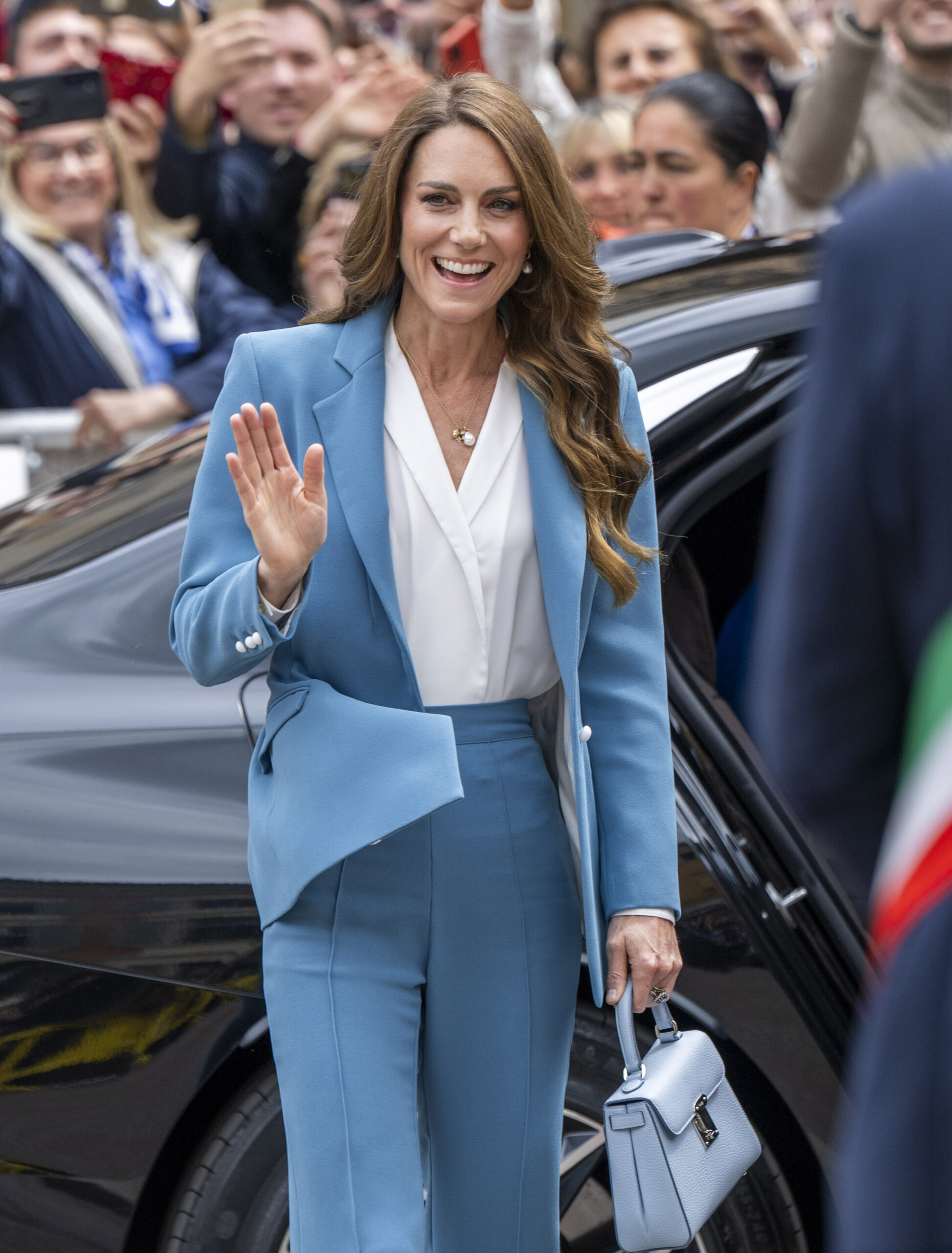 Princess Kate Middleton waving and smiling in Italy