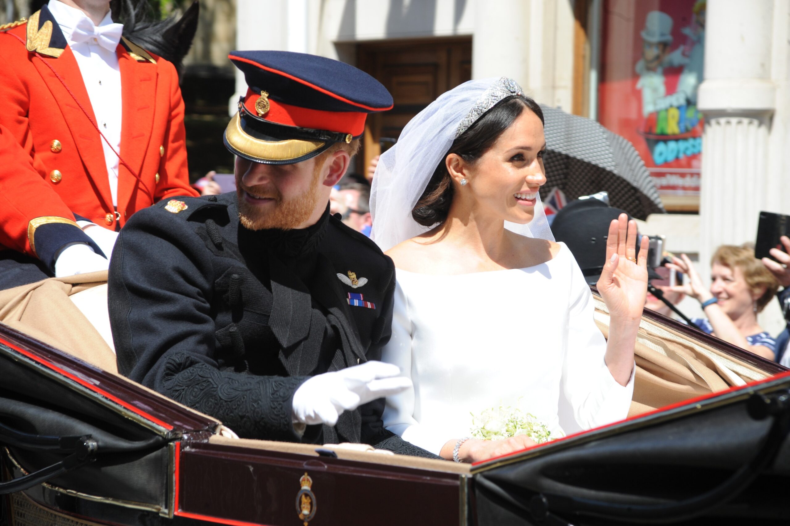 Prince Harry and Meghan Markle waving on their wedding day