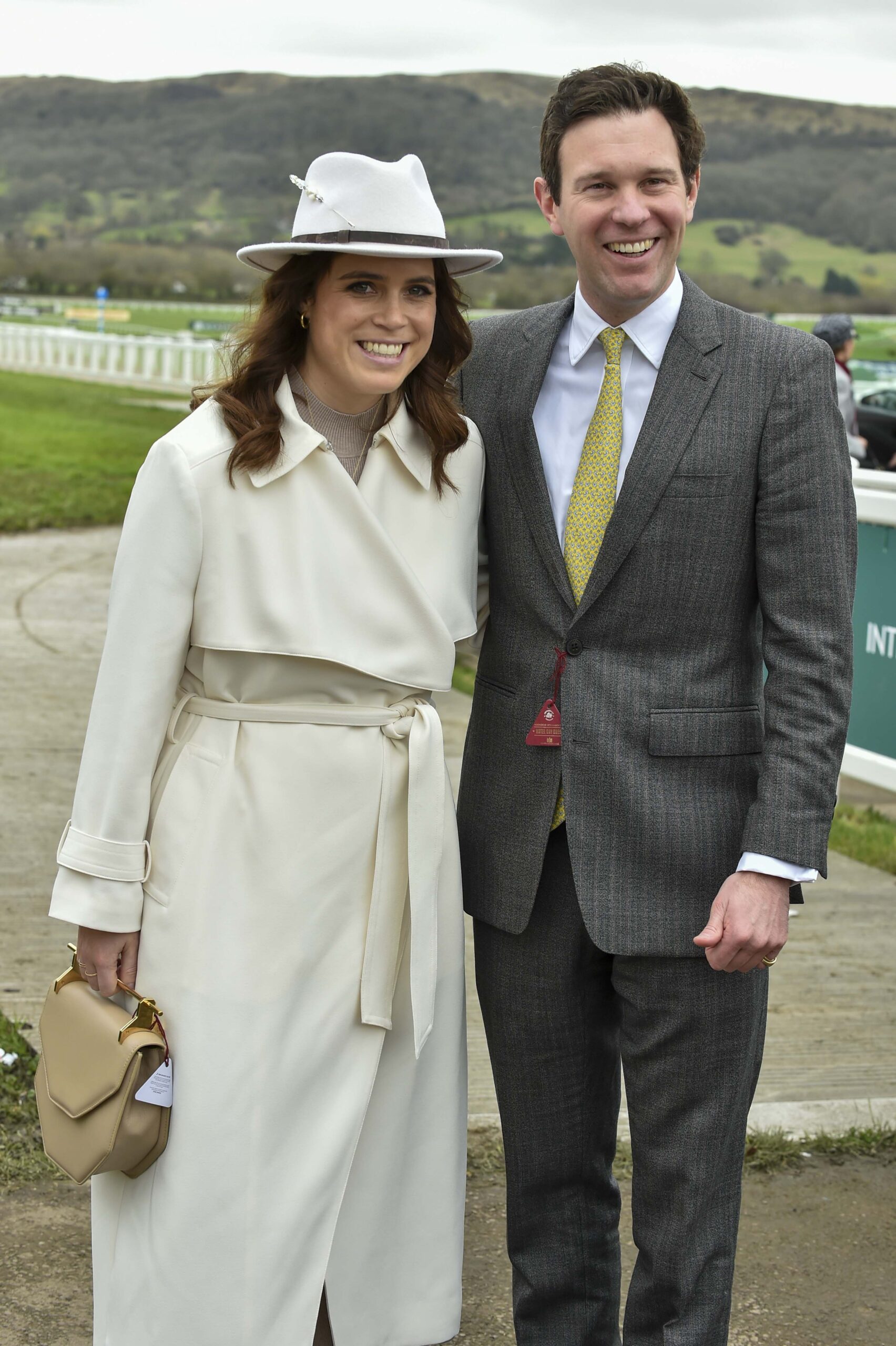 Princess Eugenie and Jack Brooksbank smiling at races