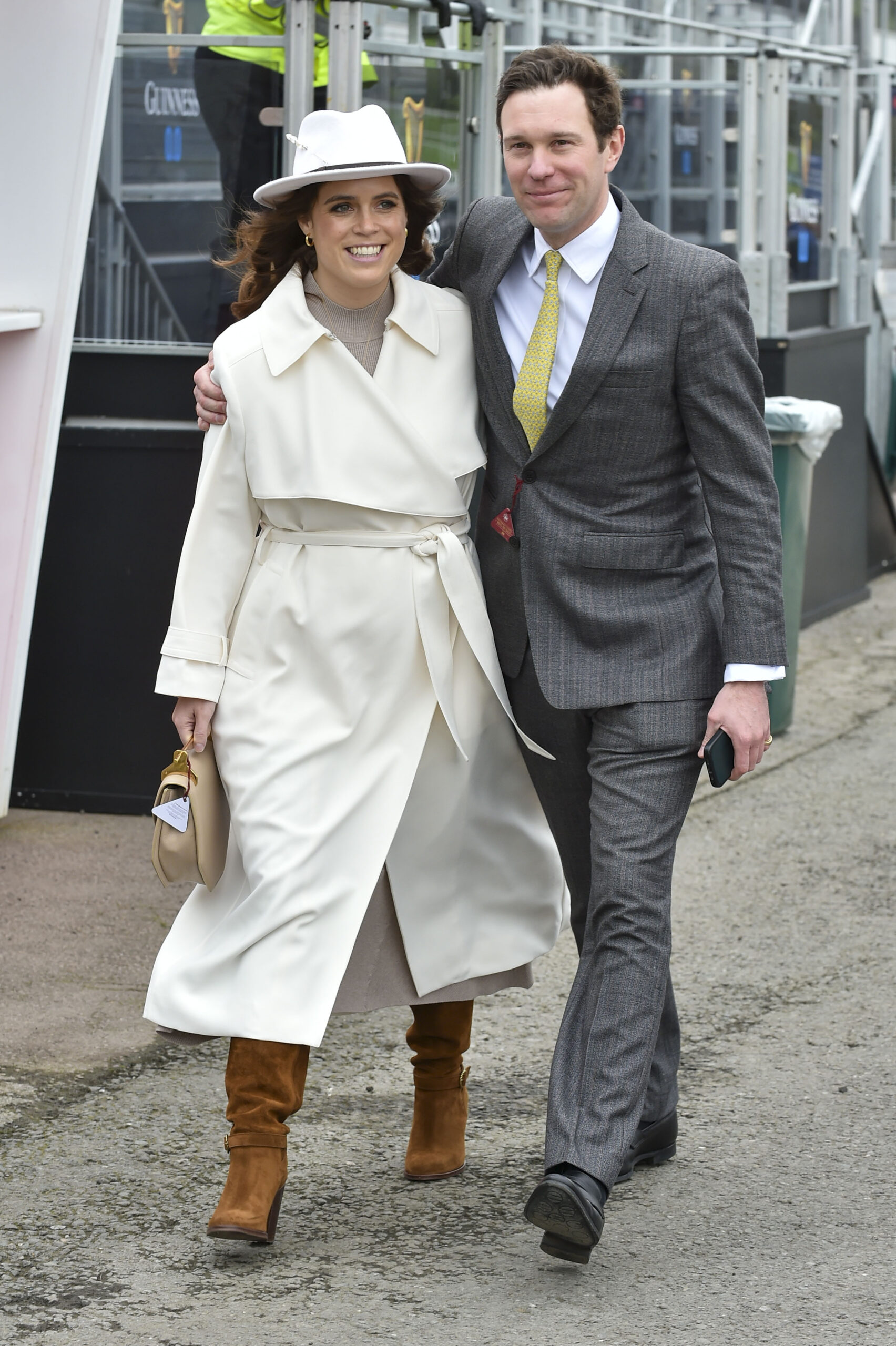 Princess Eugenie walking with Jack Brooksbank and smiling