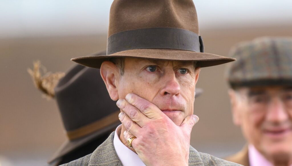 Prince Edward with his hand on his face