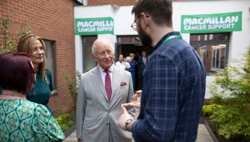 King Charles speaking to staff at hospital