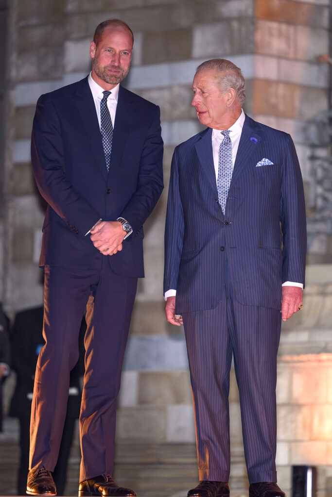 Prince William and King Charles in suits