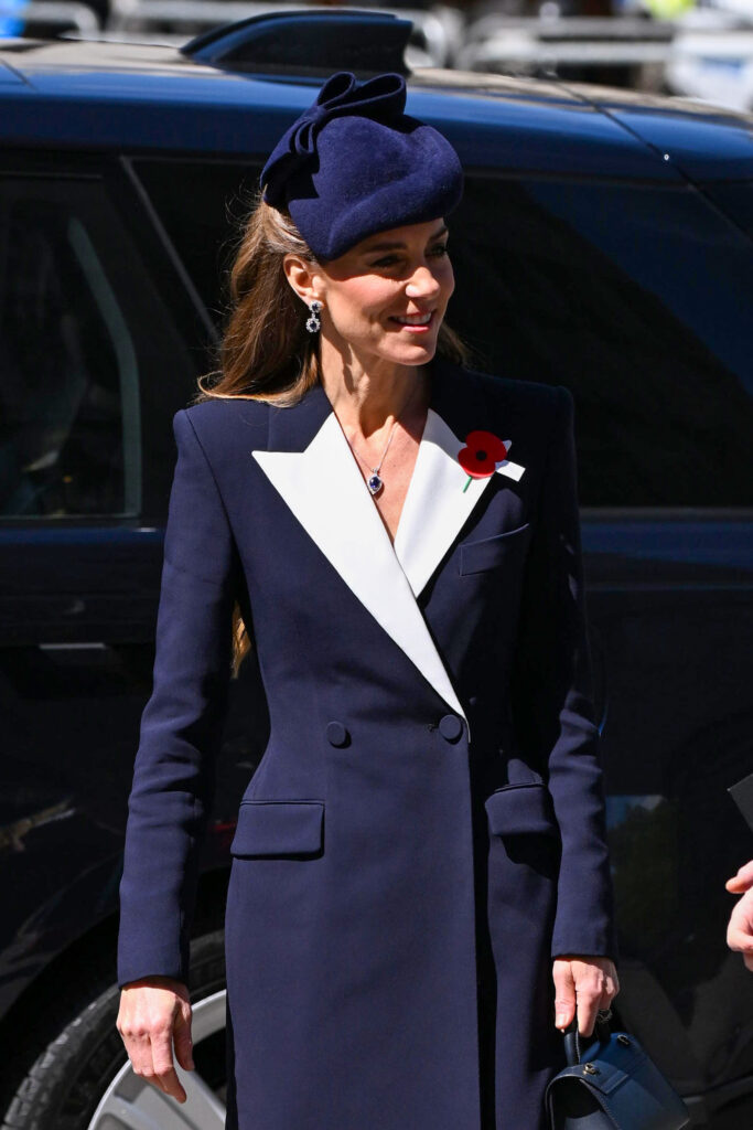 Kate Middleton in navy outfit smiling